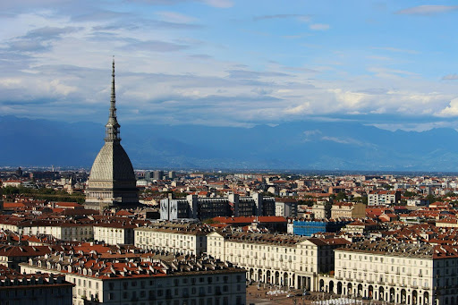 Panoramic view of Turin in Italy with the Mole Antonelliana and the Alps in spring.
