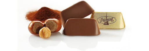 Gianduiotti, Turin's iconic chocolate made with cocoa and Piedmont hazelnuts, presented in its traditional golden packaging